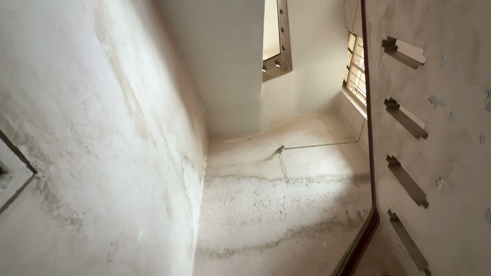 The staircase vault, caught in raking afternoon light.